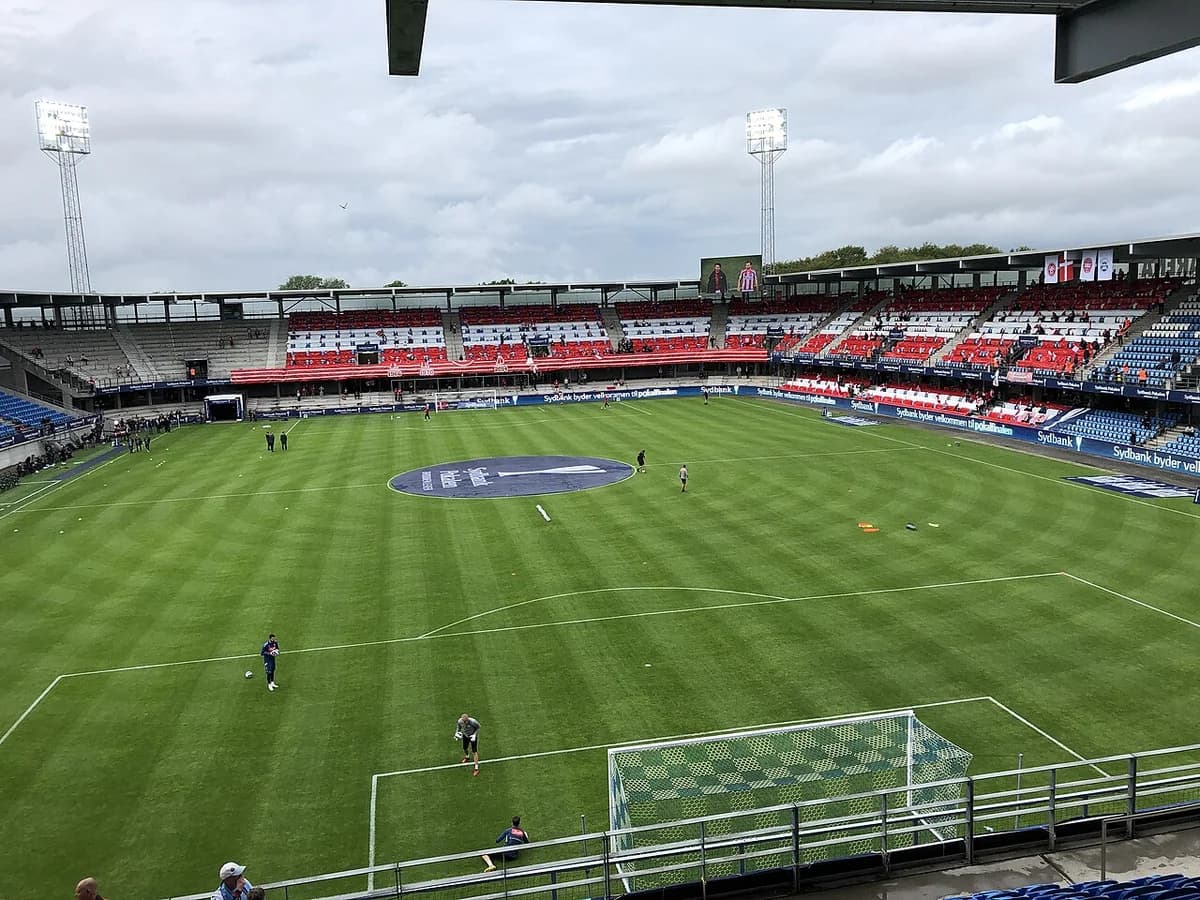 Wide view of a football stadium in Esbjerg during the DBU Cup final.